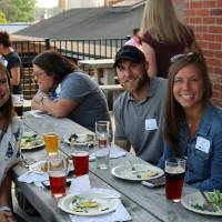 Members of the Young Alumni Council pose at Founders Brewing Co.